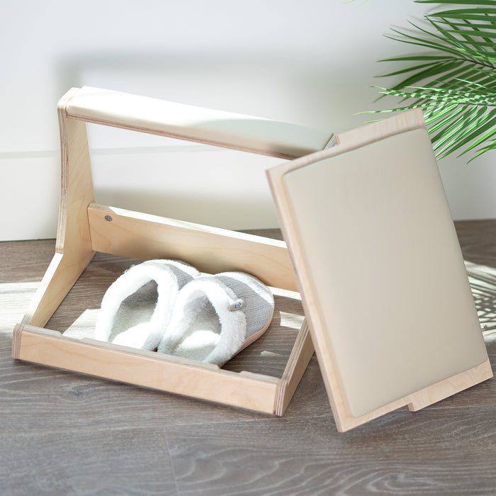 A birch wood footrest with a white cushion on top and storage compartment beneath.