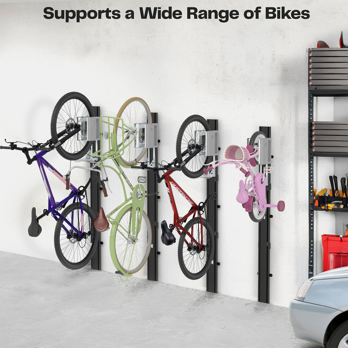 Four various sized bikes mounted on a wall in a garage.