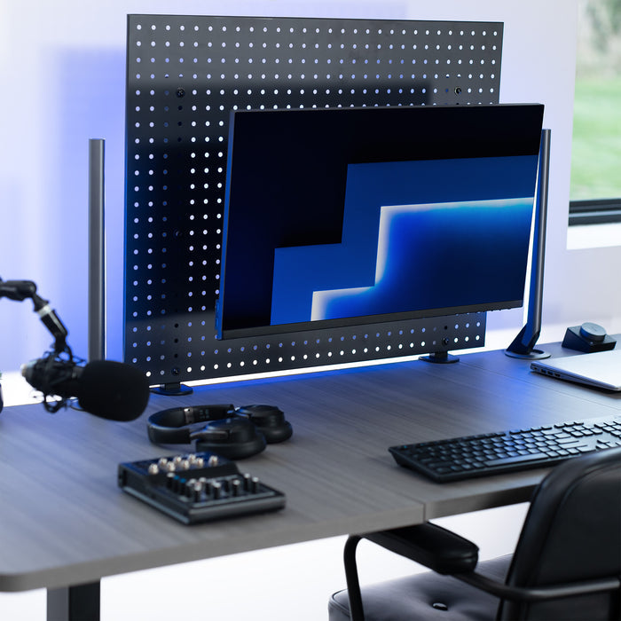 Pegboard monitor mount with articulating arm.