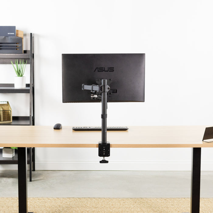 Clamp on desk mount with ASUS monitor mounted.