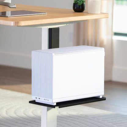 Magnetic utility shelf attached to a steel desk frame for convenient extra storage and workspace organization.