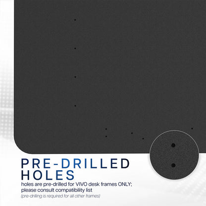 Black desktop with pre-drilled holes for VIVO desk frames on a white background