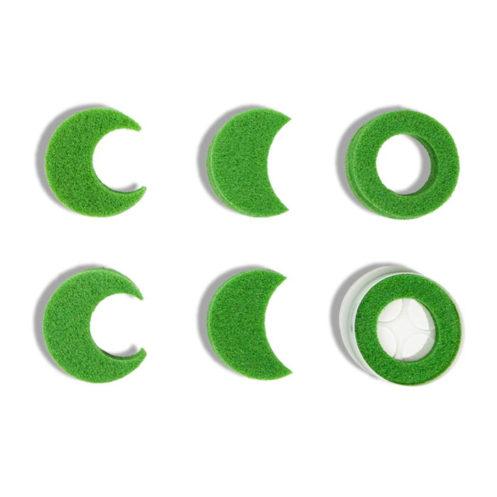 Six green BirdieBall Assorted Hole Reduction Inserts & a Double Depth Alignment Cup are arranged in two rows on a white background; one features a white ball, perfect for golf putting training.