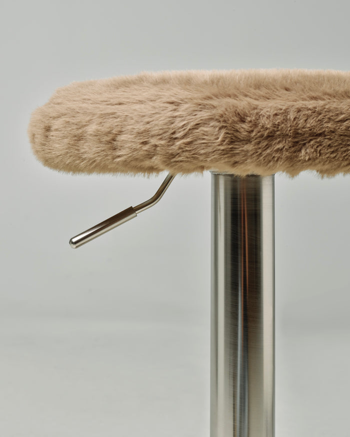 t4option0_1 | Close-up of the Gigi bar stool with a soft Brown cushion and stainless steel height-adjustment mechanism.