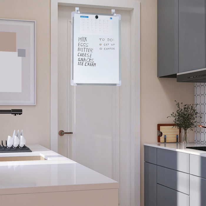 White, double-sided magnetic dry erase board mounted on a kitchen door.