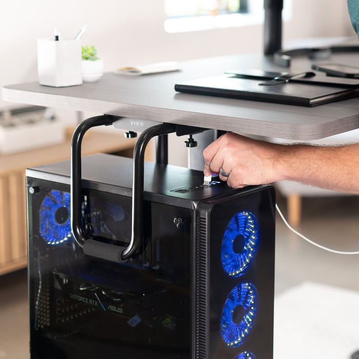 Sturdy under desk PC mount with adjustable width and height and protective padding included.