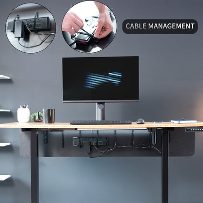 A black laminate modesty panel attached to a wooden desk with a black leg frame with cable management feature highlighted.