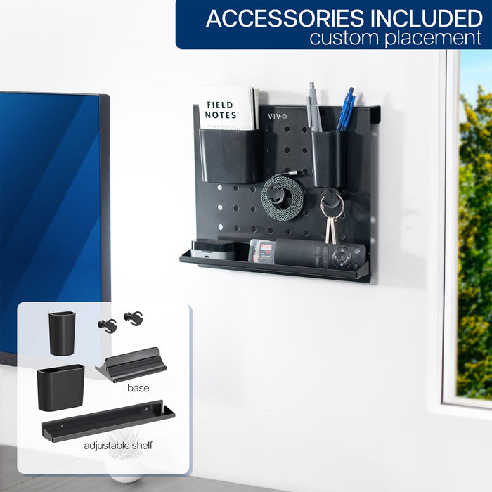 A black pegboard desk organizer with various slots and holders for office supplies and a mobile phone.