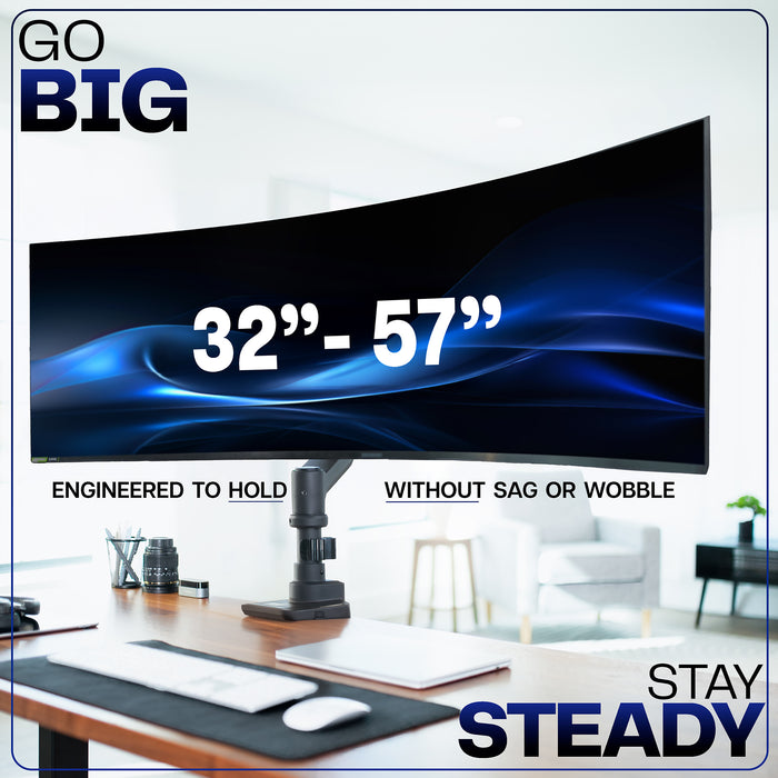 Monitor arm supporting a large widescreen display, highlighting stable positioning