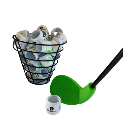 A wire basket of white BirdieBall practice golf balls is displayed next to the Premium Backyard Training Golf Club with its oversized club head on a white background.