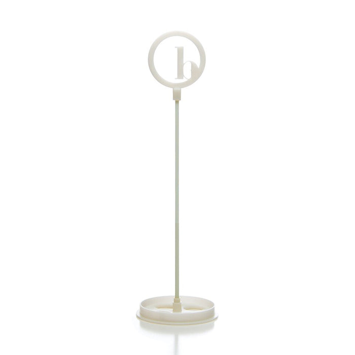 The BirdieBall Putting Green Cups and Flags (Options Available) features a white plastic stand with a round frame holding a lowercase "b," making it an ideal accessory or replacement for your BirdieBall putting green.