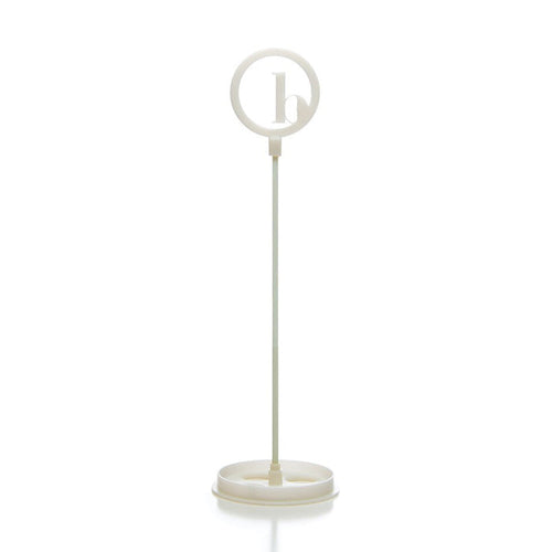 The BirdieBall Putting Green Cups and Flags (Options Available) features a white plastic stand with a round frame holding a lowercase "b," making it an ideal accessory or replacement for your BirdieBall putting green.